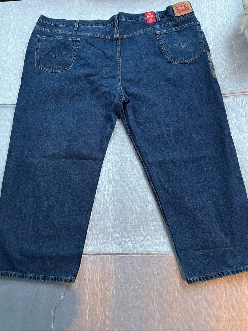 NWT Levi's 550’s with a 63W x 30L relaxed fit.